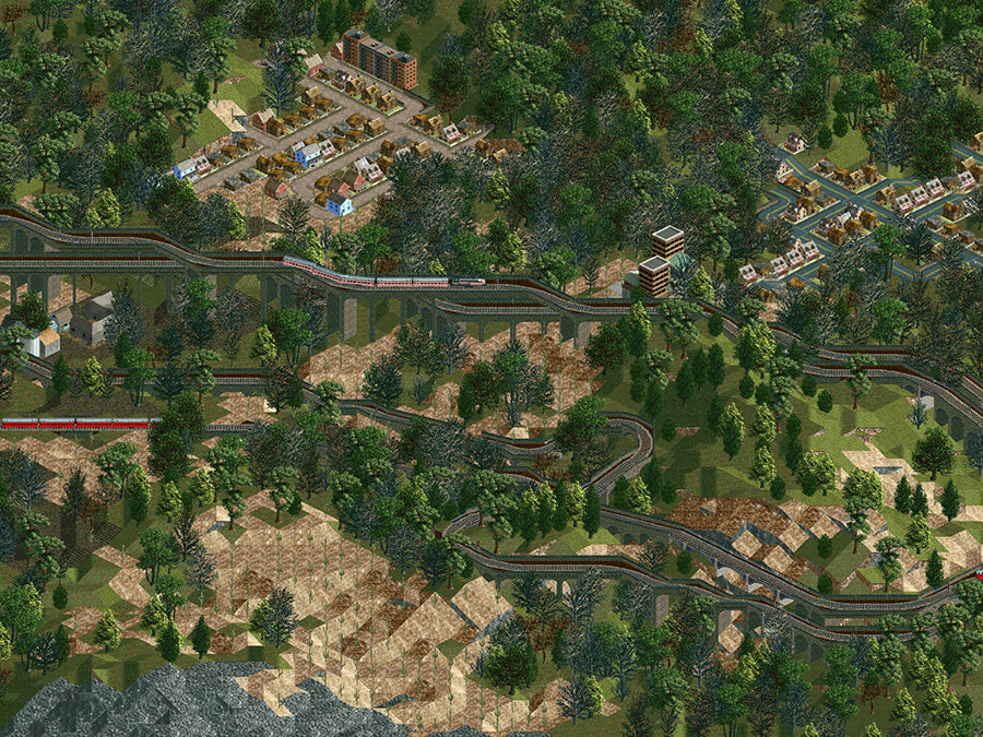 Züge überqueren hohe Brücken zwischen bewaldeten Bergen in Transport Tycoon