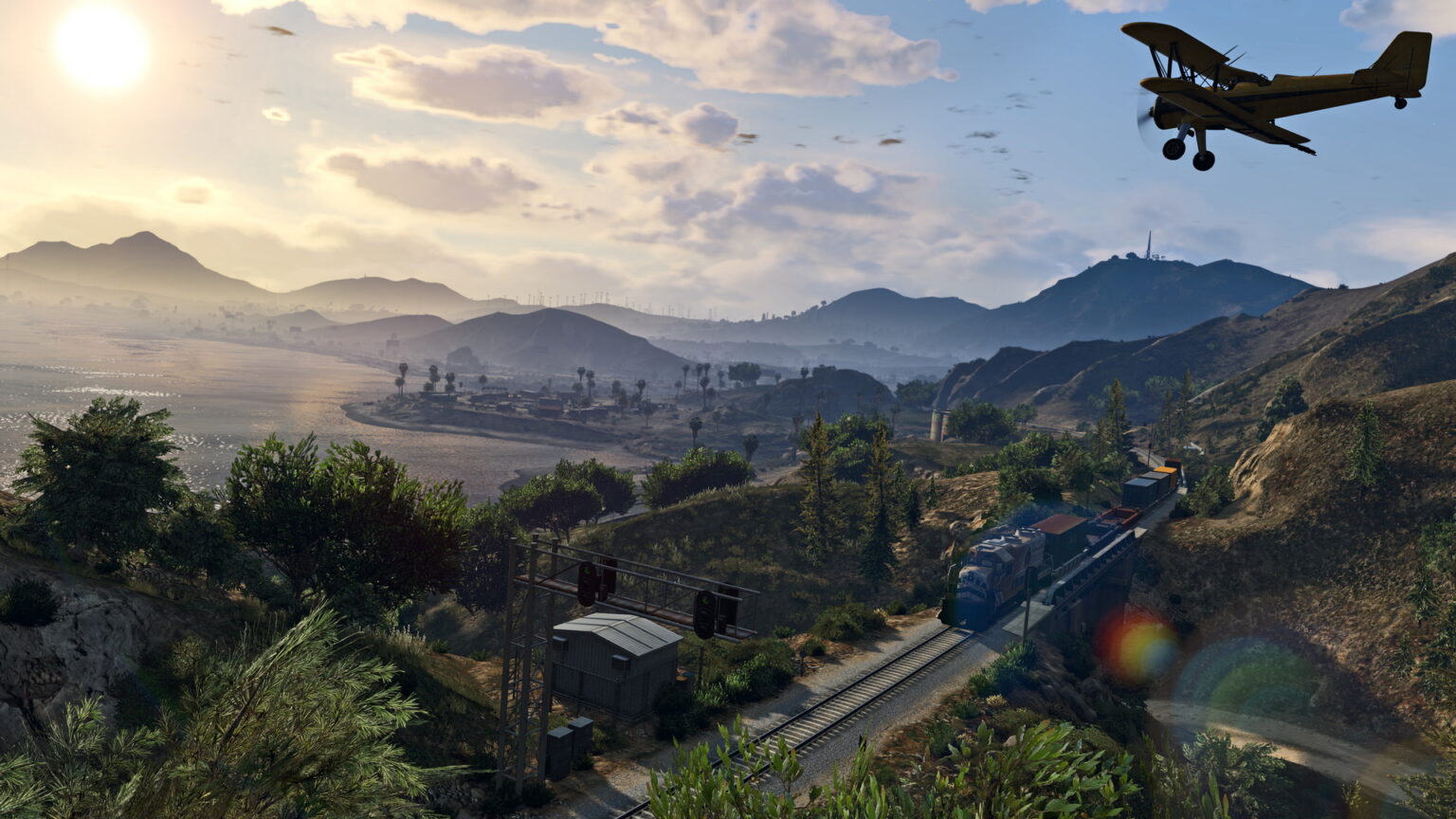 Offizieller GTA-V-Screenshot mit Landschaft, Eisenbahn und Flugzeug als Illustration des Spiels, keine Aufnahme der GTA:MP-Modifikation - Bild: Rockstar Games
