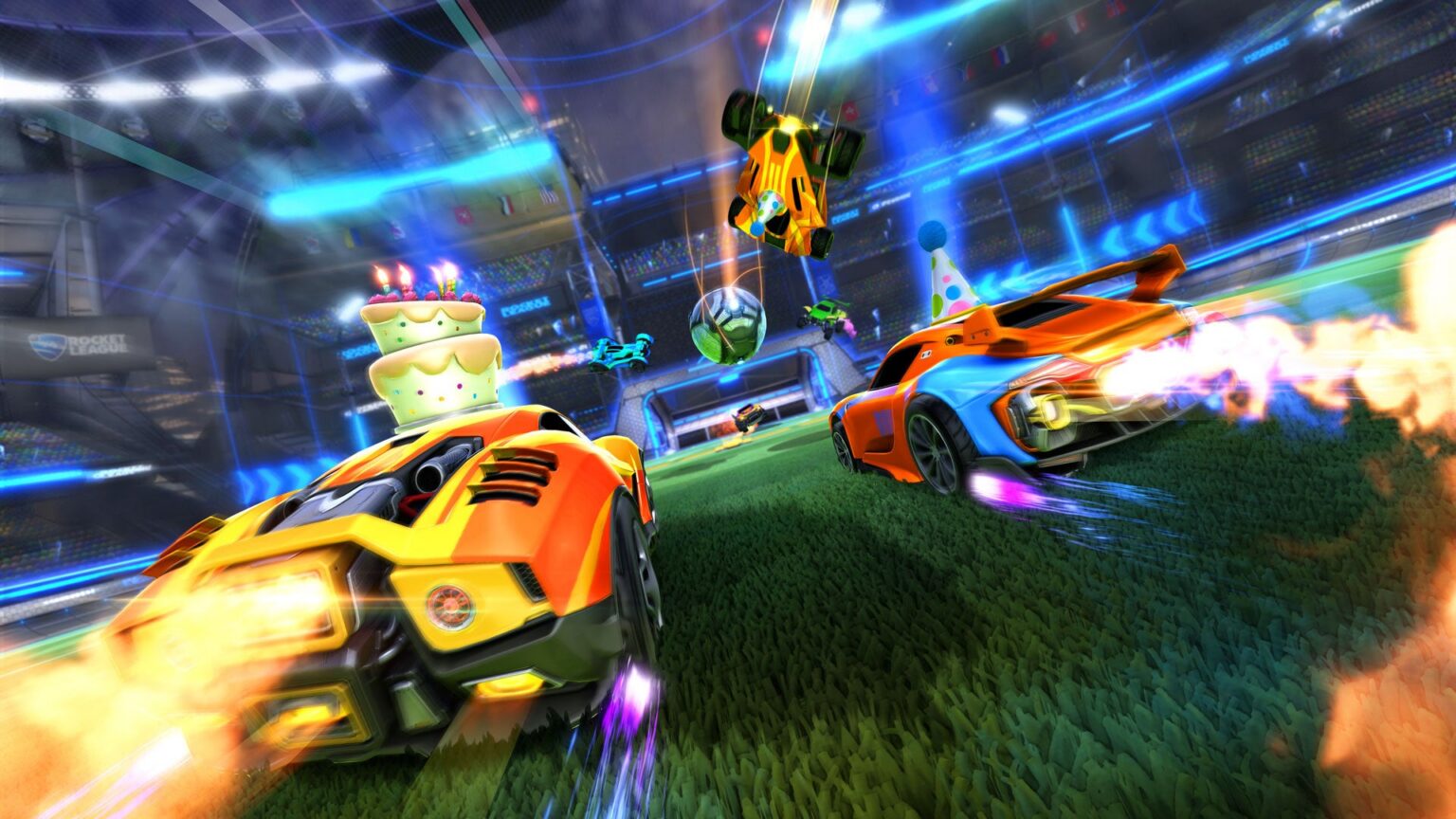 Rocket-League-Fahrzeuge mit Geburtstagstorte und Partyhüten im Stadion - Bild: Psyonix